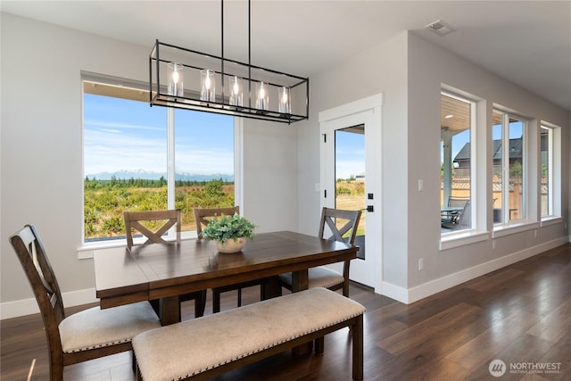 381 E Benson Ridge Rd, Grapeview, WA 98546 - dining space with a chandelier, dark wood-style floors, and a mountain view