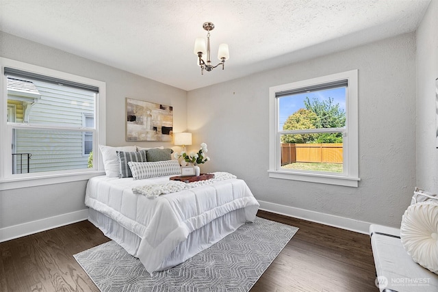 213 S 58th St, Tacoma, WA 98408 - bedroom featuring a chandelier and wood finished floors