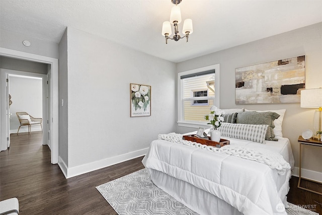 213 S 58th St, Tacoma, WA 98408 - bedroom featuring a chandelier and dark wood-style floors