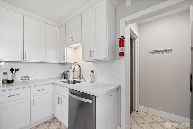 213 S 58th St, Tacoma, WA 98408 - kitchen featuring stainless steel dishwasher, white cabinets, light countertops, decorative backsplash, and light tile patterned floors