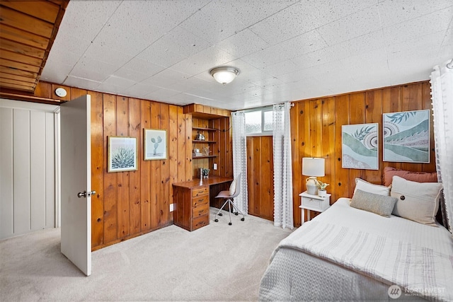 213 S 58th St, Tacoma, WA 98408 - bedroom with light colored carpet, wood walls, and a desk