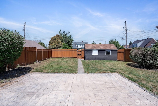 213 S 58th St, Tacoma, WA 98408 - fenced backyard with a patio area and a gate