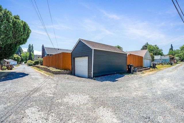 213 S 58th St, Tacoma, WA 98408 - detached garage featuring gravel driveway