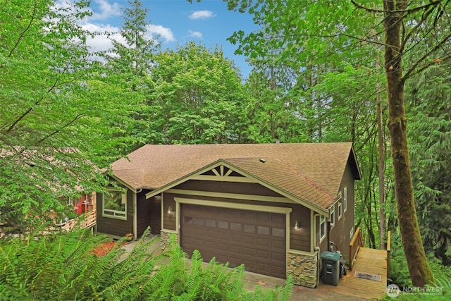 49 Cascade Ln, Bellingham, WA 98229 - view of front of home featuring an attached garage, roof with shingles, and stone siding