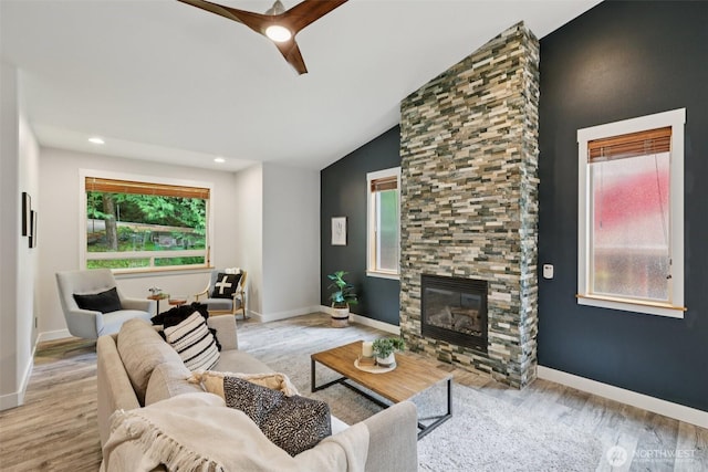 49 Cascade Ln, Bellingham, WA 98229 - living room featuring wood finished floors, vaulted ceiling, a fireplace, a ceiling fan, and recessed lighting