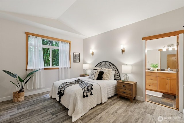 49 Cascade Ln, Bellingham, WA 98229 - bedroom with lofted ceiling, light wood finished floors, and connected bathroom