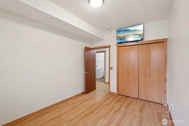 49 Cascade Ln, Bellingham, WA 98229 - unfurnished bedroom featuring light wood finished floors and washer / dryer