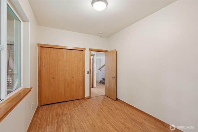 49 Cascade Ln, Bellingham, WA 98229 - unfurnished bedroom featuring light wood-type flooring and a closet