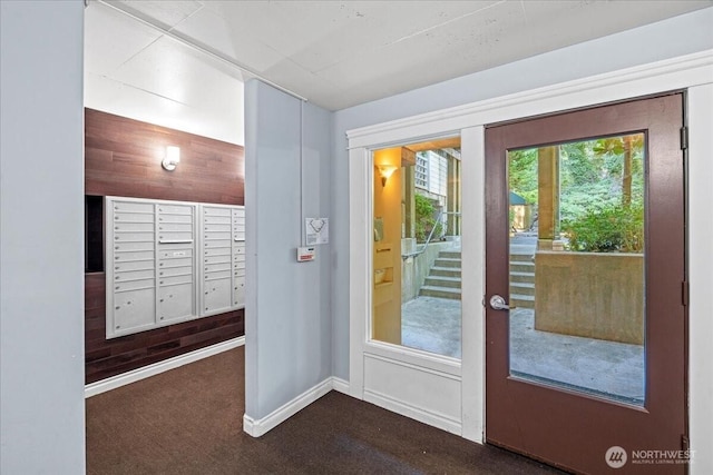 700 N 160th St Unit A316, Shoreline, WA 98133 - doorway to outside featuring mail area and baseboards