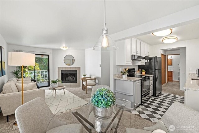 700 N 160th St Unit A316, Shoreline, WA 98133 - living area with a tiled fireplace and carpet