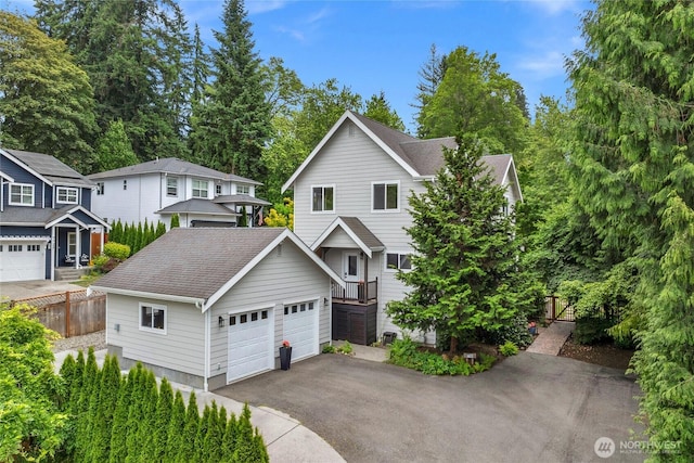 7709 NE 170th St, Kenmore, WA 98028 - view of front of home with a detached garage and a shingled roof