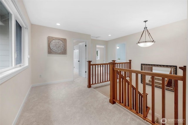 7709 NE 170th St, Kenmore, WA 98028 - hallway with an upstairs landing, light colored carpet, and recessed lighting