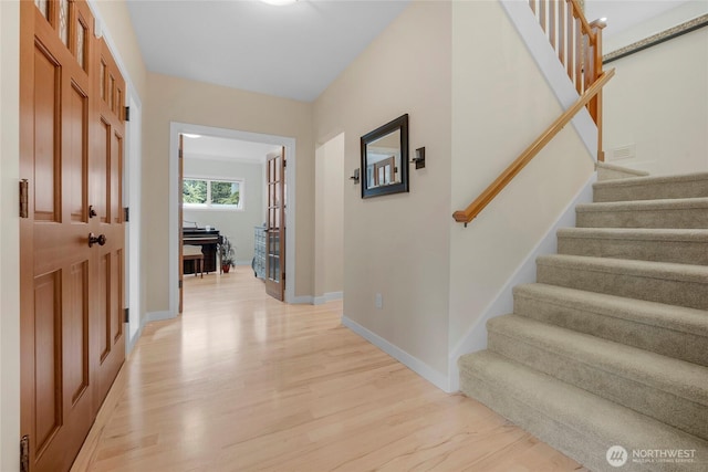 7709 NE 170th St, Kenmore, WA 98028 - foyer with light wood finished floors and stairway