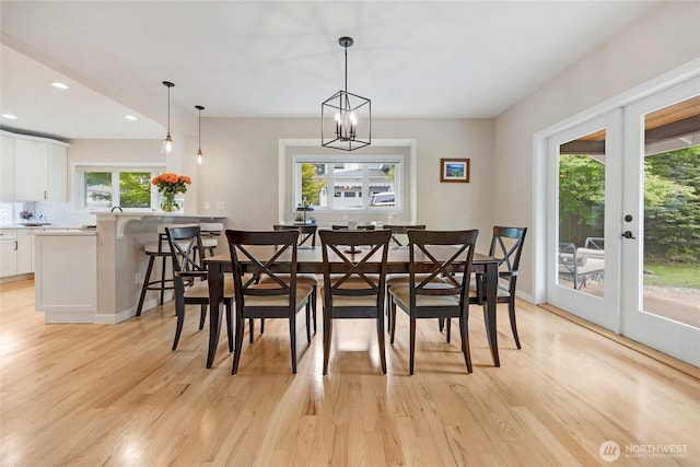 7709 NE 170th St, Kenmore, WA 98028 - dining area featuring light wood-style floors, recessed lighting, french doors, and a chandelier