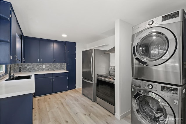 1308 S 359th St, Federal Way, WA 98003 - washroom with stacked washer / drying machine and light wood-style flooring