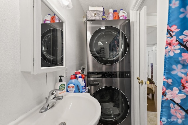 1308 S 359th St, Federal Way, WA 98003 - bathroom with stacked washer / drying machine, a textured ceiling, and tile patterned flooring