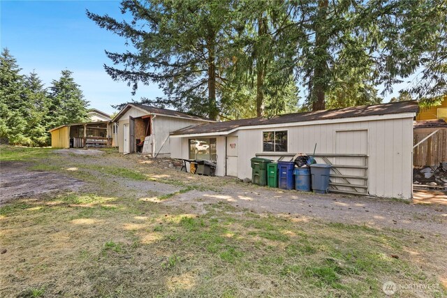 1308 S 359th St, Federal Way, WA 98003 - rear view of property with an outdoor structure and an outbuilding
