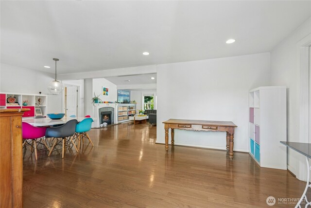7826 SE 24th St, Mercer Island, WA 98040 - dining room with a warm lit fireplace, wood finished floors, and recessed lighting