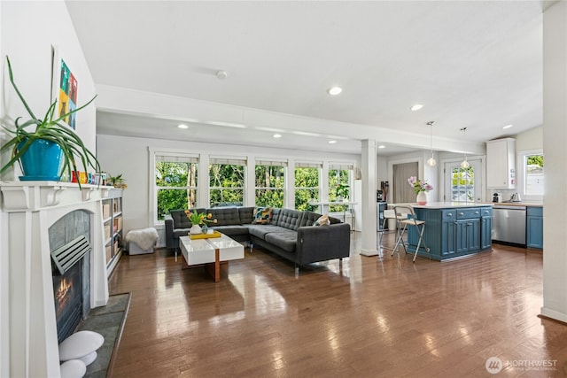 7826 SE 24th St, Mercer Island, WA 98040 - living room featuring dark wood-style floors, recessed lighting, and a glass covered fireplace