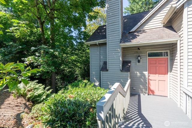 4123 150th Ave SE, Bellevue, WA 98006 - property entrance featuring a chimney and a shingled roof