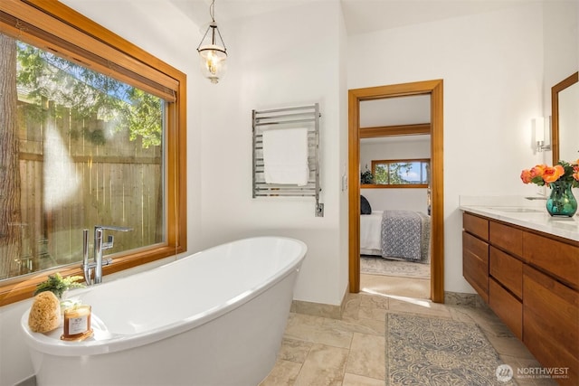 3969 Palomino Dr NE, Bainbridge Island, WA 98110 - full bath with vanity, plenty of natural light, a soaking tub, and ensuite bathroom