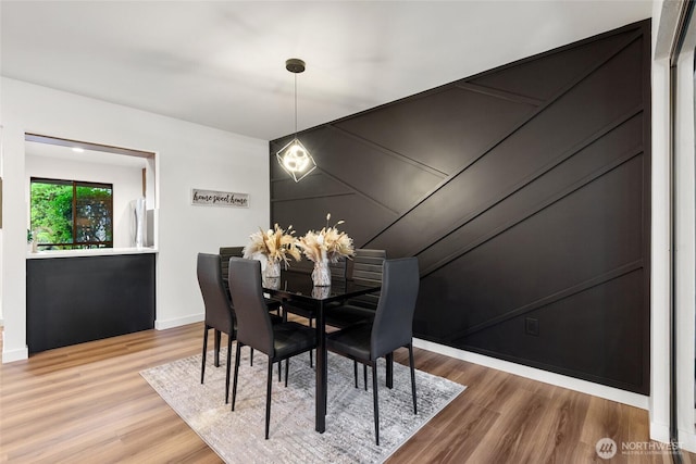 10305 NE 16th St Unit I6, Bellevue, WA 98004 - dining room featuring baseboards and wood finished floors