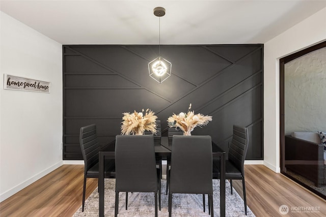 10305 NE 16th St Unit I6, Bellevue, WA 98004 - dining room with a decorative wall and wood finished floors