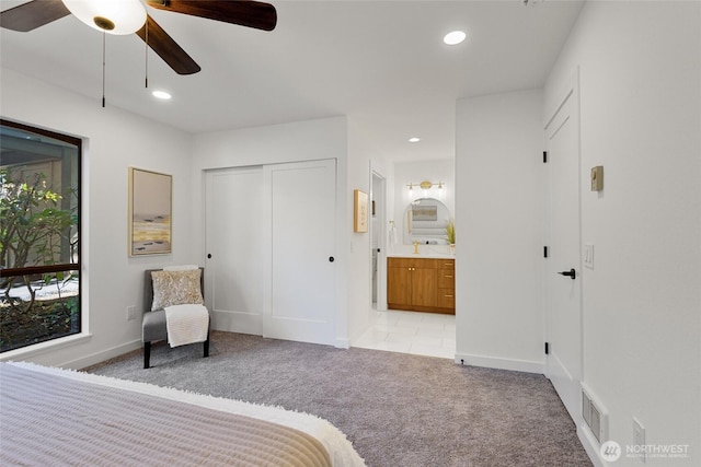 10305 NE 16th St Unit I6, Bellevue, WA 98004 - bedroom with light colored carpet, recessed lighting, connected bathroom, a ceiling fan, and a closet