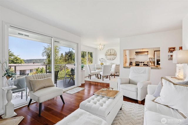 4181 W Lake Sammamish Pkwy SE Unit B301, Bellevue, WA 98008 - living room with a chandelier and wood finished floors