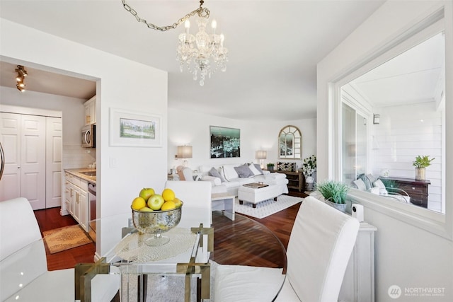 4181 W Lake Sammamish Pkwy SE Unit B301, Bellevue, WA 98008 - dining space with dark wood-style floors and a chandelier