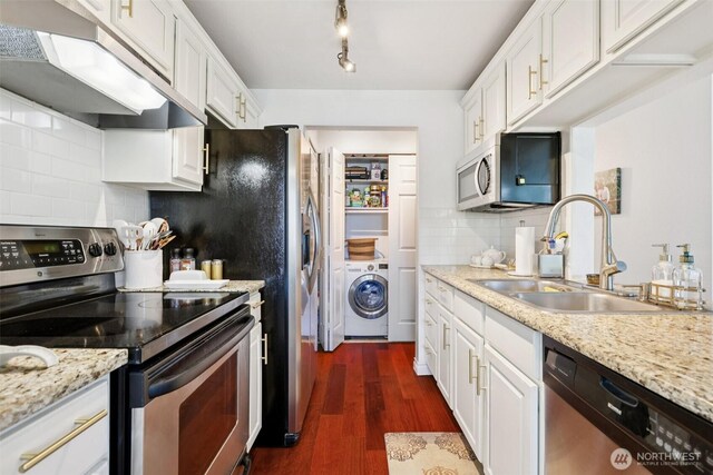 4181 W Lake Sammamish Pkwy SE Unit B301, Bellevue, WA 98008 - kitchen featuring stainless steel appliances, ventilation hood, washer / clothes dryer, and white cabinetry