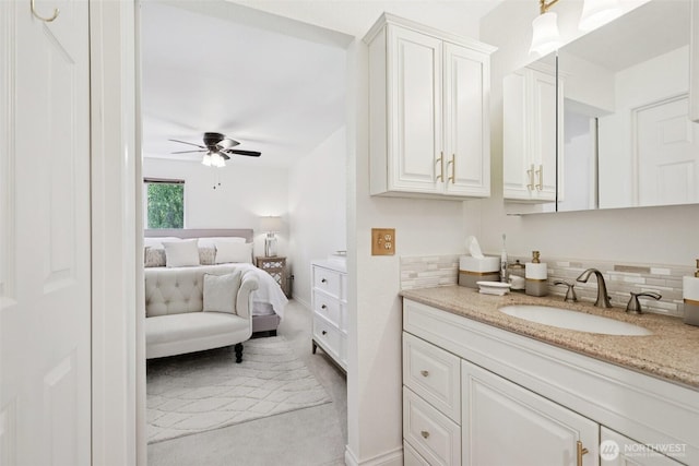4181 W Lake Sammamish Pkwy SE Unit B301, Bellevue, WA 98008 - bathroom with ensuite bath, ceiling fan, vanity, and decorative backsplash