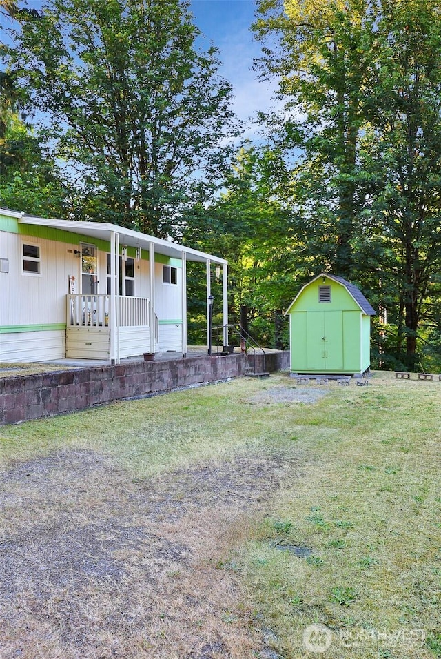 31809 148th Way SE, Auburn, WA 98092 - view of green lawn featuring a storage unit and a porch