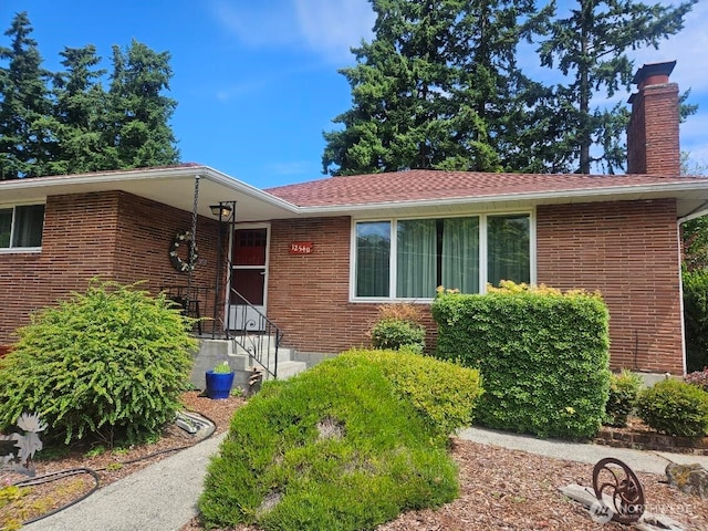 12540 3rd Ave NW, Seattle, WA 98177 - view of front of property featuring brick siding and a chimney