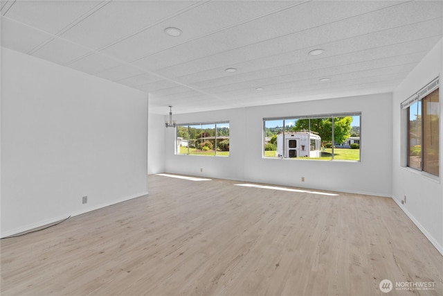 1402 22nd St NE Unit 39, Auburn, WA 98002 - unfurnished room featuring light wood-style flooring, recessed lighting, and a chandelier