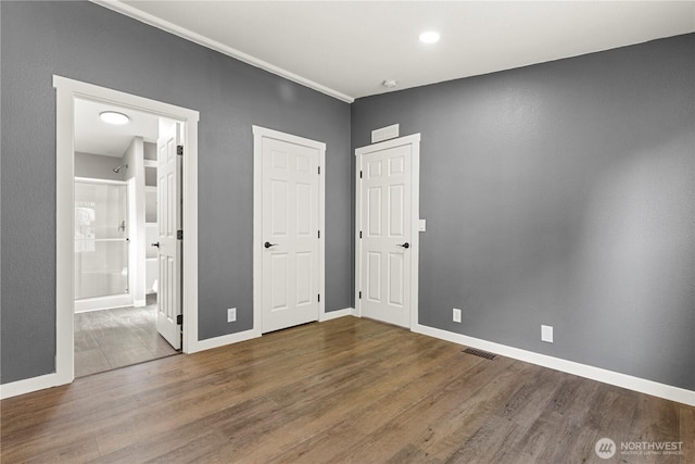 7113 E Dakota St, Port Orchard, WA 98366 - unfurnished bedroom with wood finished floors and ensuite bath