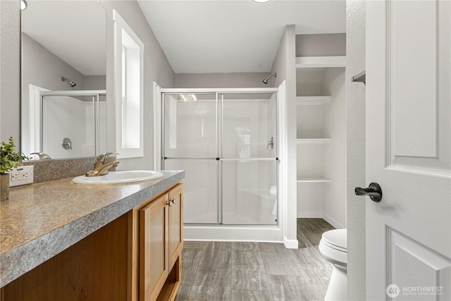7113 E Dakota St, Port Orchard, WA 98366 - bathroom featuring a stall shower, wood finished floors, and vanity