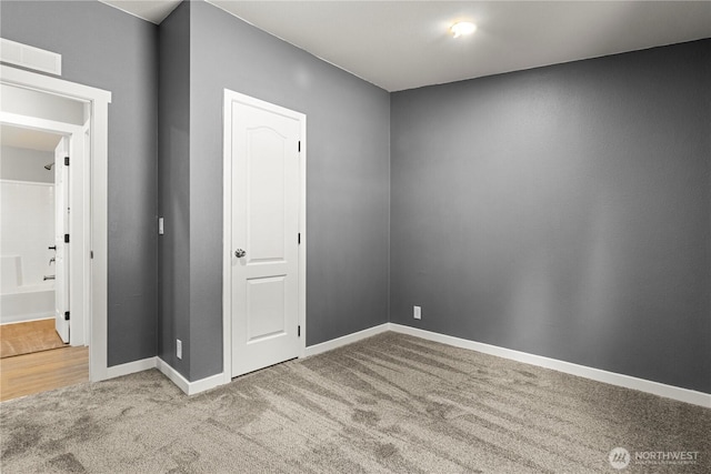7113 E Dakota St, Port Orchard, WA 98366 - unfurnished bedroom featuring carpet and baseboards