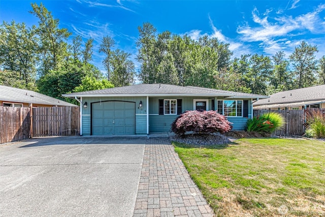406 Brown Way SE, Orting, WA 98360 - ranch-style house featuring an attached garage and driveway