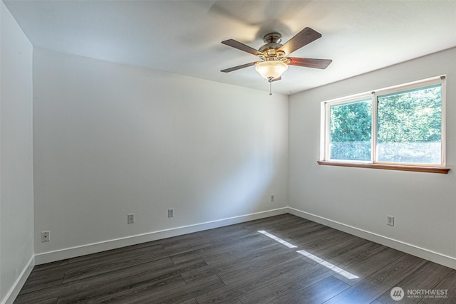 406 Brown Way SE, Orting, WA 98360 - spare room featuring dark wood-type flooring and ceiling fan