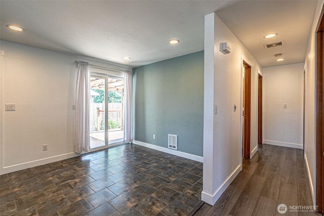 406 Brown Way SE, Orting, WA 98360 - unfurnished room featuring baseboards and recessed lighting