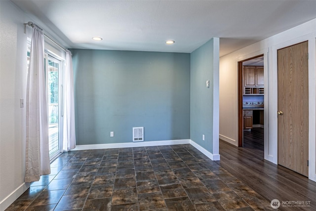 406 Brown Way SE, Orting, WA 98360 - empty room with recessed lighting and baseboards