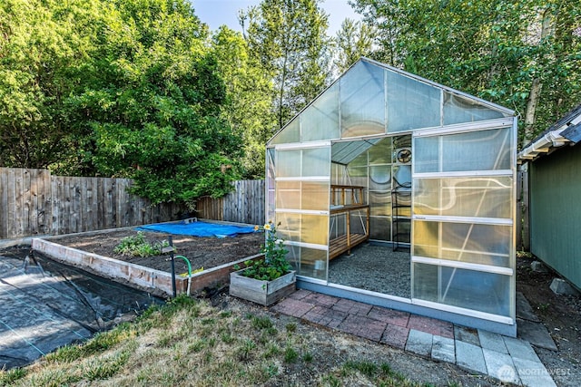 406 Brown Way SE, Orting, WA 98360 - view of greenhouse with a vegetable garden