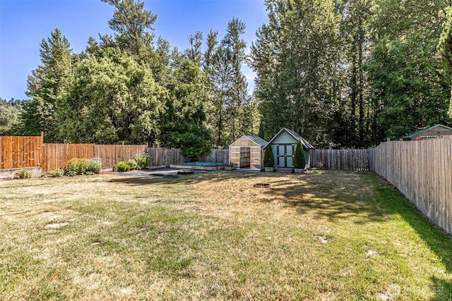 406 Brown Way SE, Orting, WA 98360 - fenced backyard with an outdoor structure