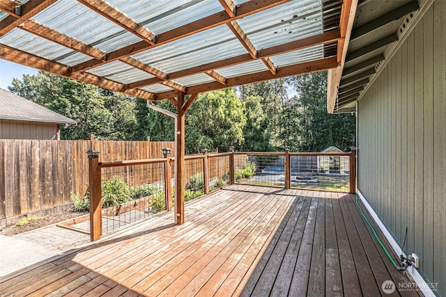 406 Brown Way SE, Orting, WA 98360 - deck featuring a fenced backyard and view of scattered trees