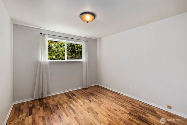 4006 147th Pl, Bellevue, WA 98006 - unfurnished room featuring wood finished floors and baseboards