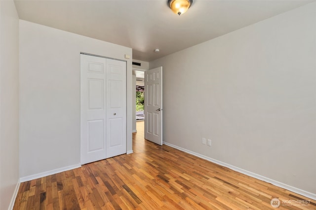 4006 147th Pl, Bellevue, WA 98006 - unfurnished bedroom with light wood-style flooring and a closet