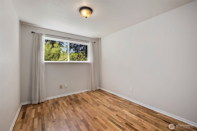 4006 147th Pl, Bellevue, WA 98006 - unfurnished room with wood finished floors and baseboards