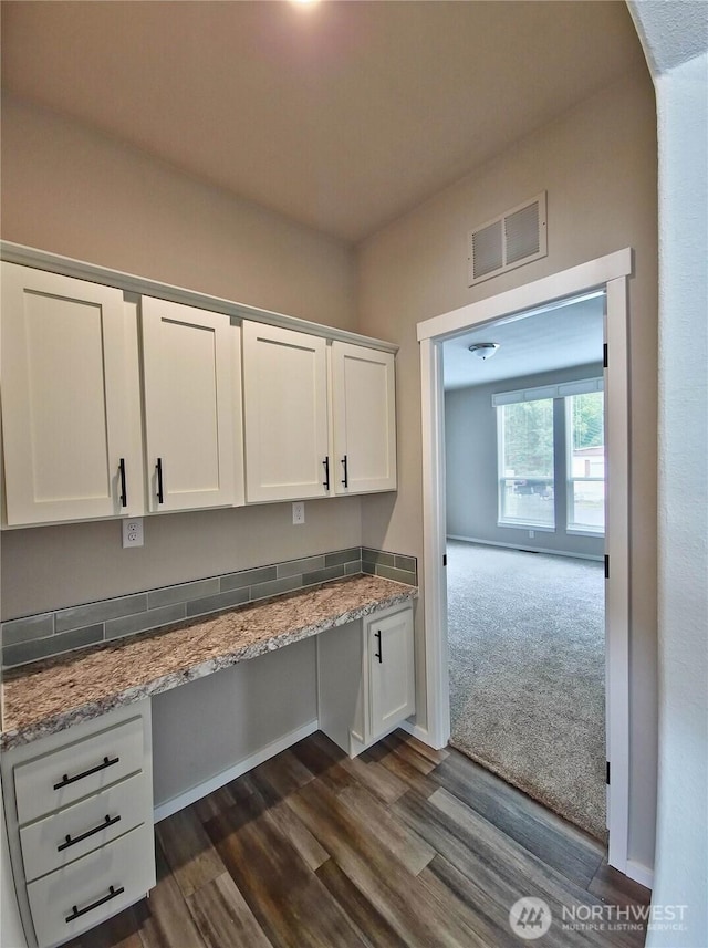 1303 30th Unit 20, Seaview, WA 98644 - unfurnished office featuring dark wood-style floors, built in desk, and arched walkways