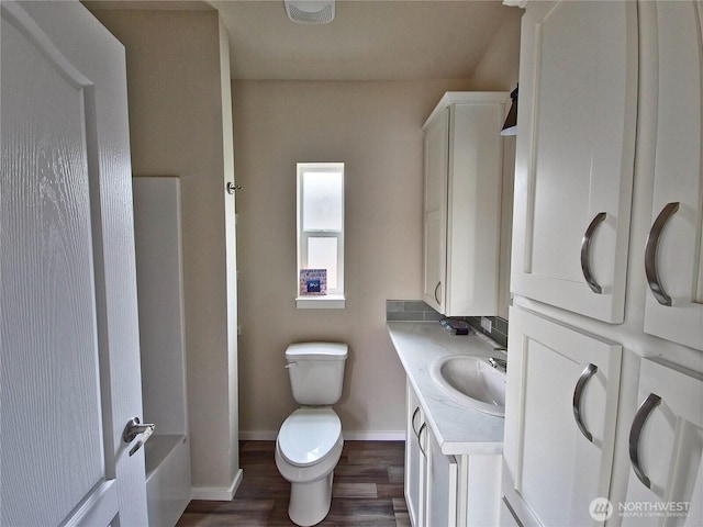 1303 30th Unit 3, Seaview, WA 98644 - bathroom featuring wood finished floors, vanity, a tub, and a shower
